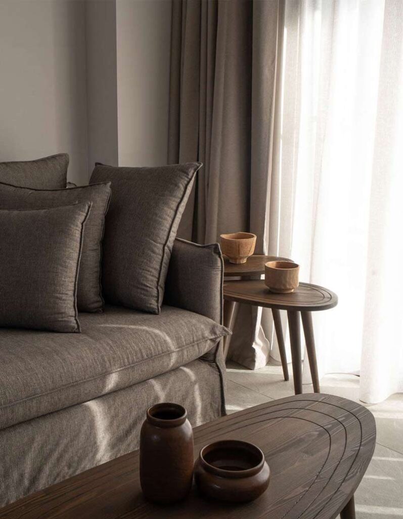 Relaxing seating area by the fireplace at Kepos Villas, perfect for winter getaways