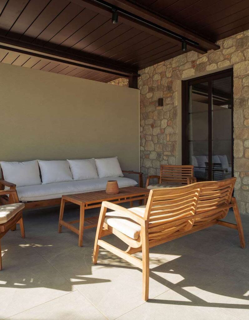 Comfortable outdoor lounge area with stylish furniture for relaxation at Kepos Villas