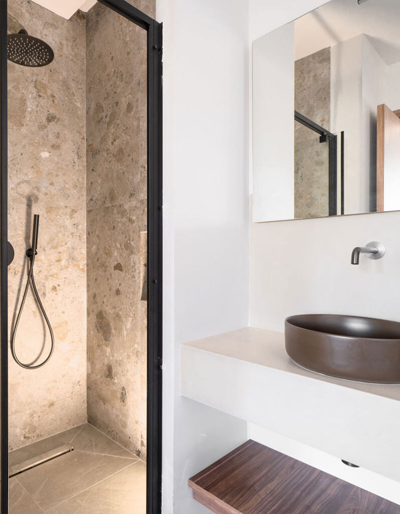 Modern spa-like bathroom with walk-in shower and premium toiletries at Kepos Villas