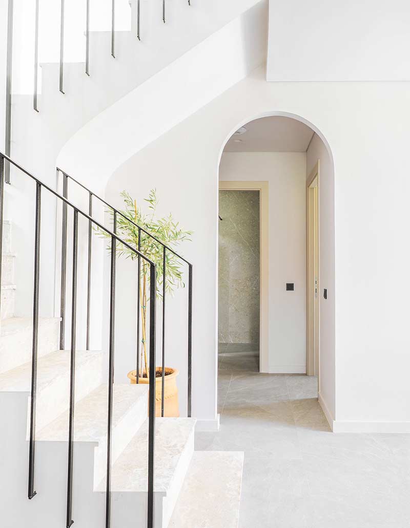 Elegant interior staircase with modern design and premium materials at Kepos Villas.