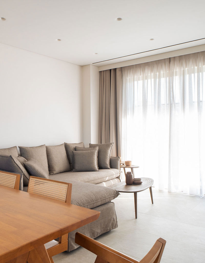 Cozy living room interior at Kepos Villas featuring a modern fireplace, comfortable sofas, and elegant decor.